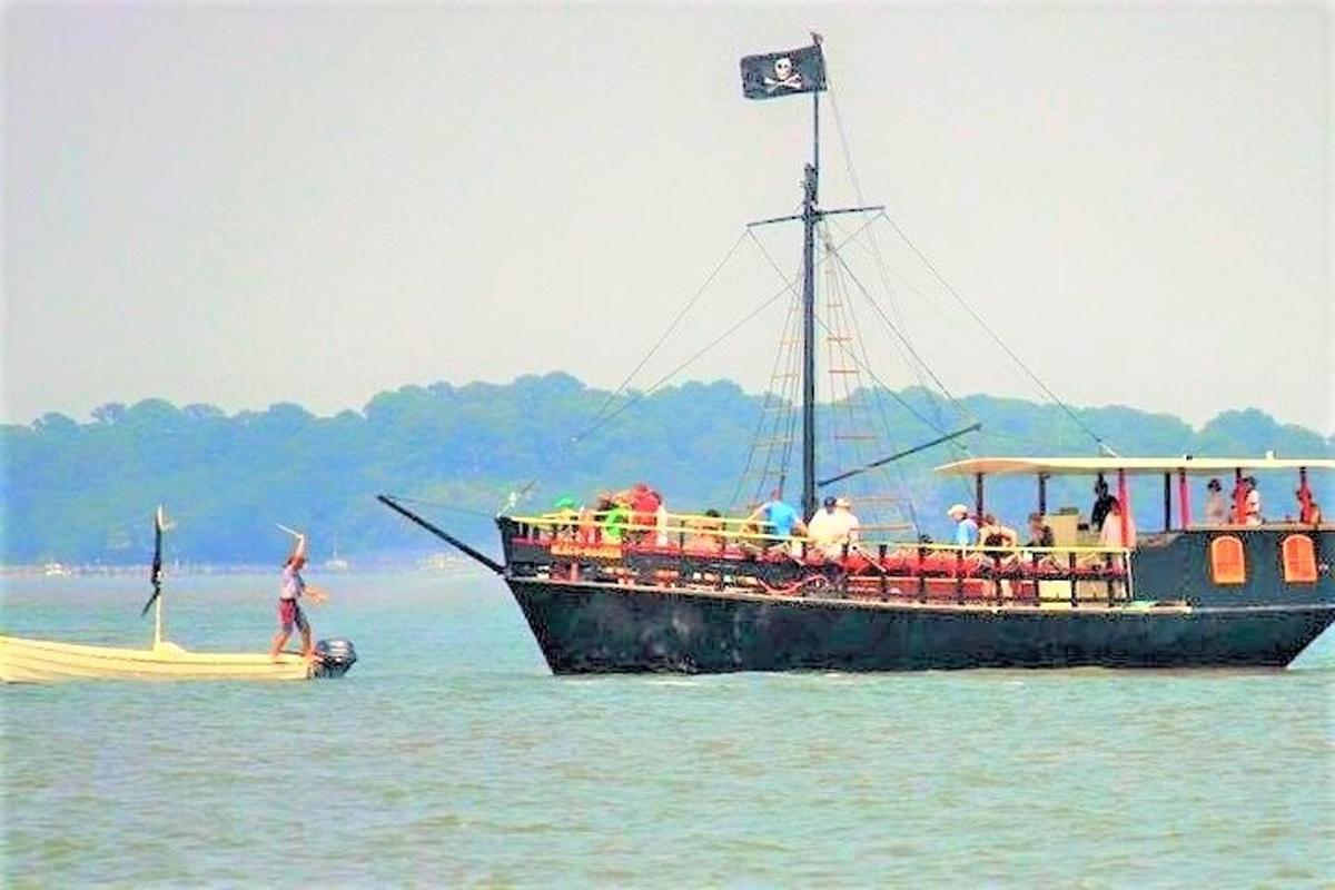 a group of people on a boat in the water
