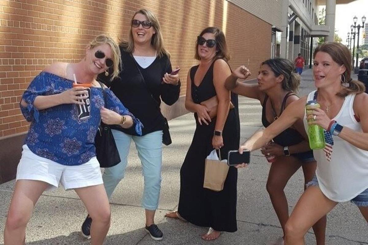 a group of women are posing for a picture