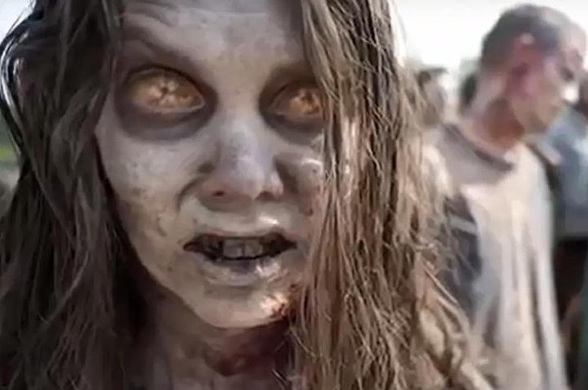 a woman with white paint on her face