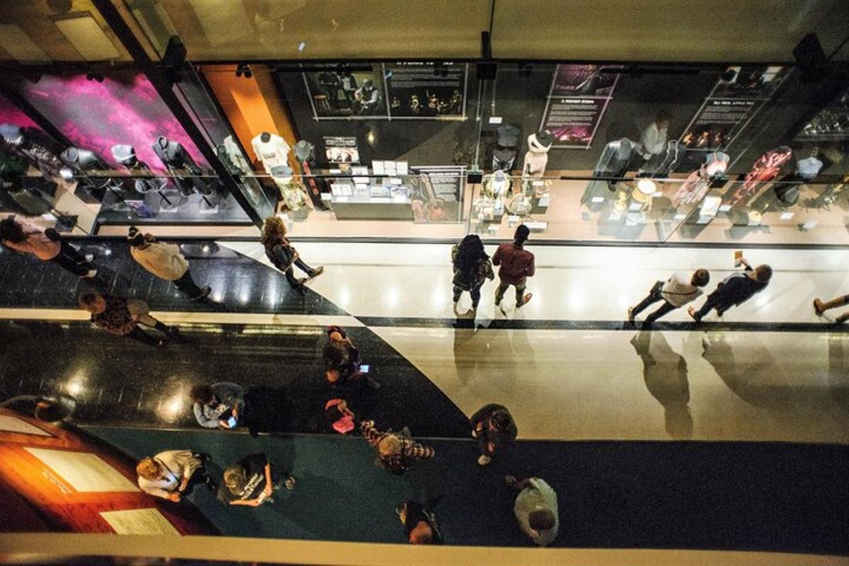 a group of people sitting on the floor in a store