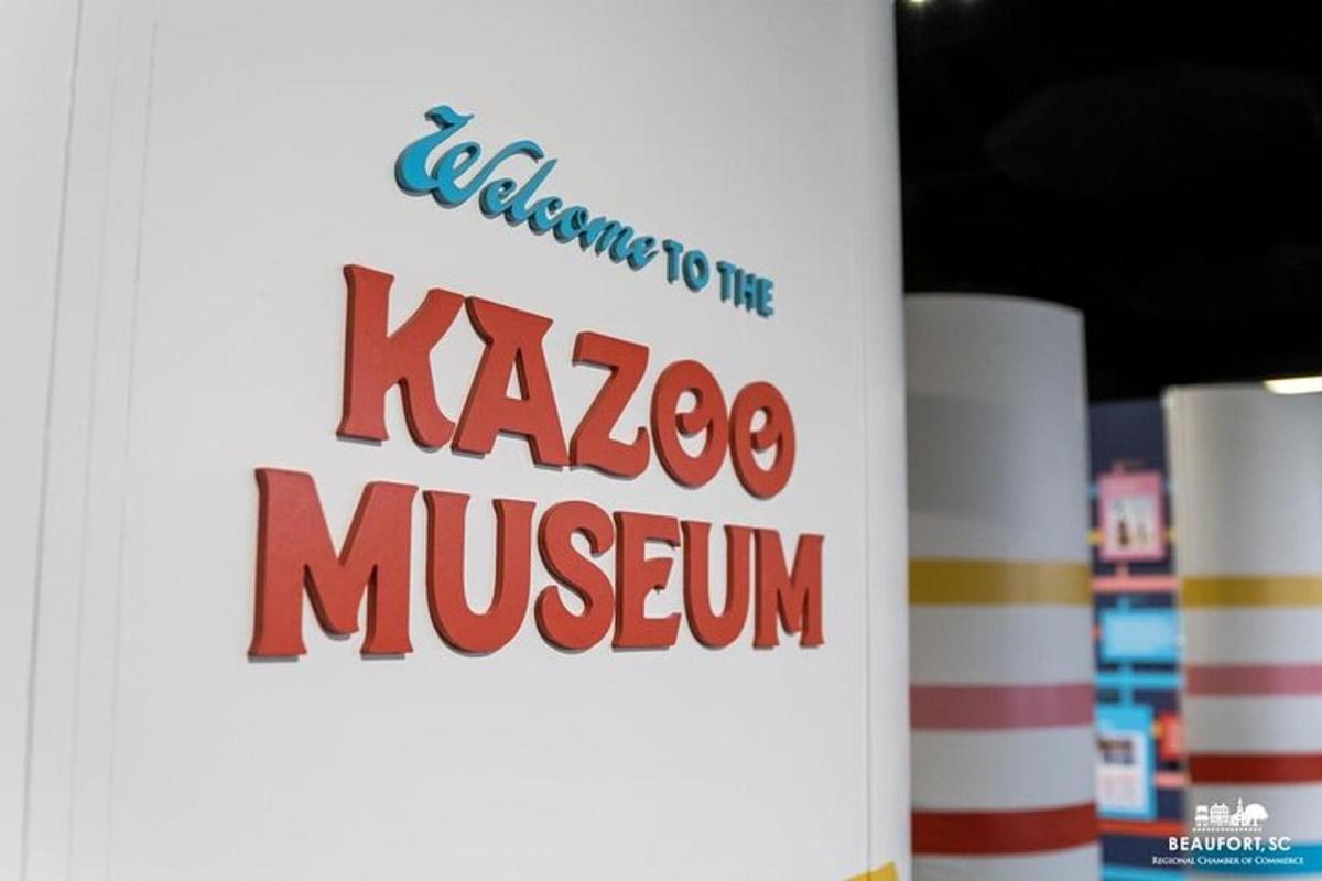 a sign for a kazoo museum on a table