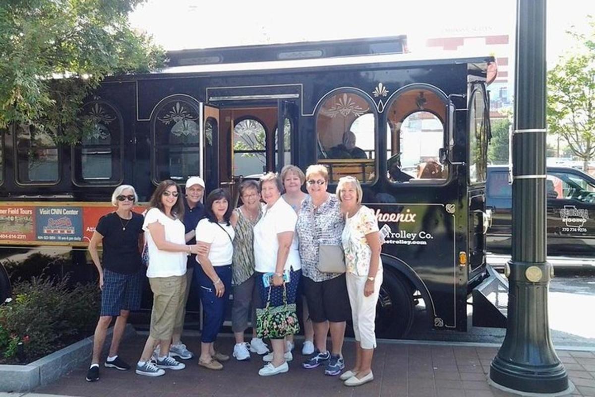 a group of people standing in front of a bus