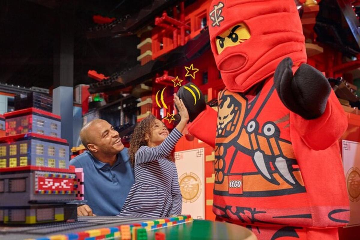 a man and a woman looking at a toy in a store