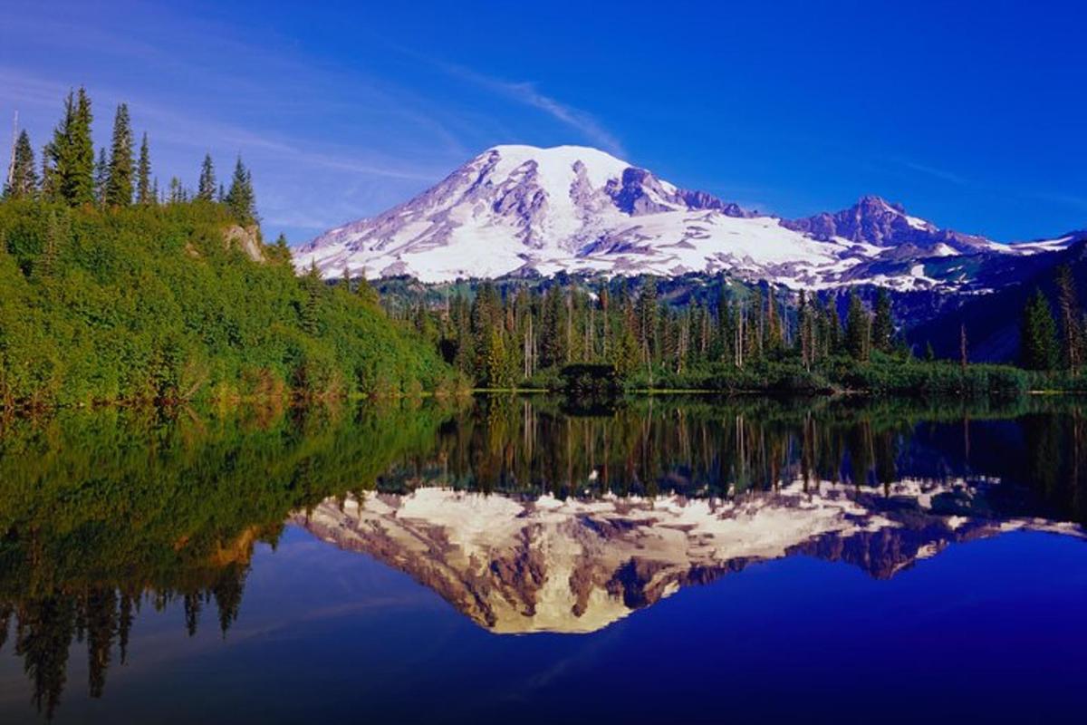 a mountain with its reflection in a lake