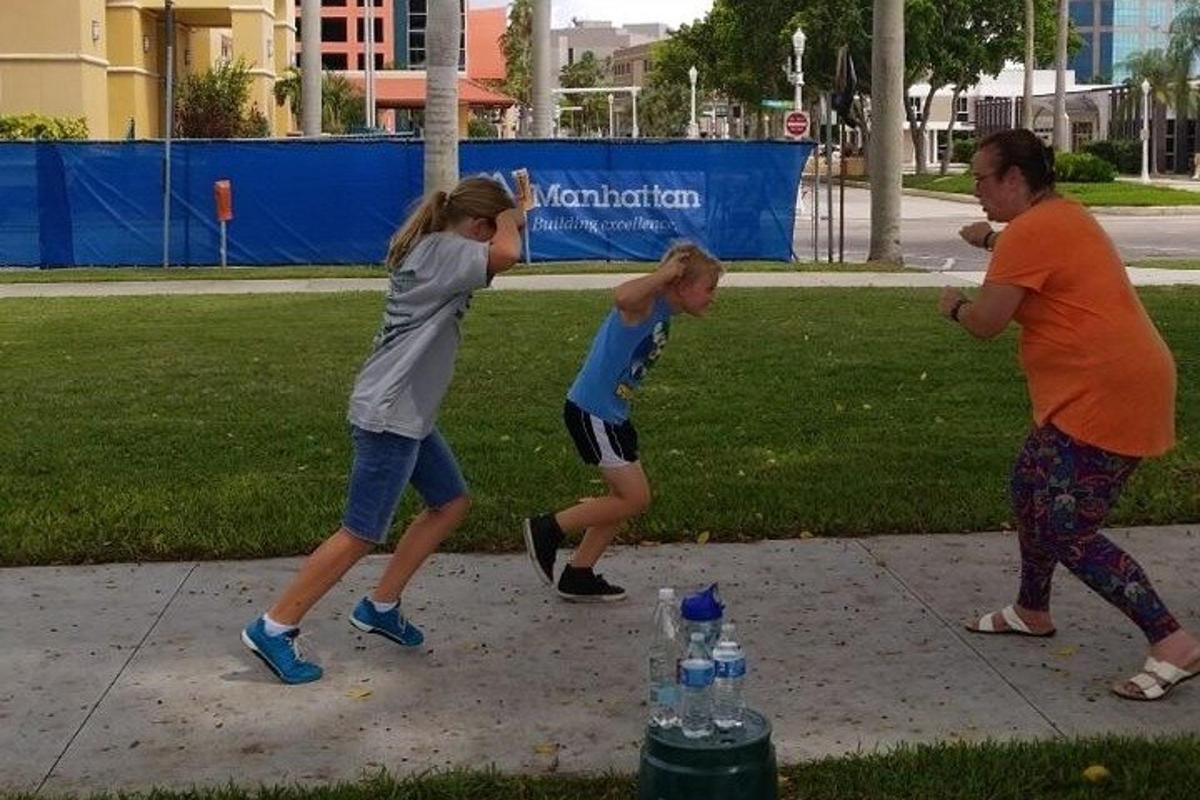 a group of girls playing a game of baseball
