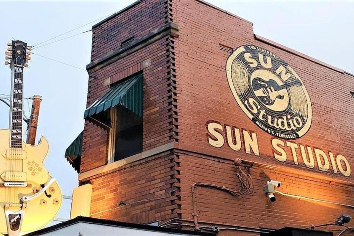 a brick building with a sun studio sign on it