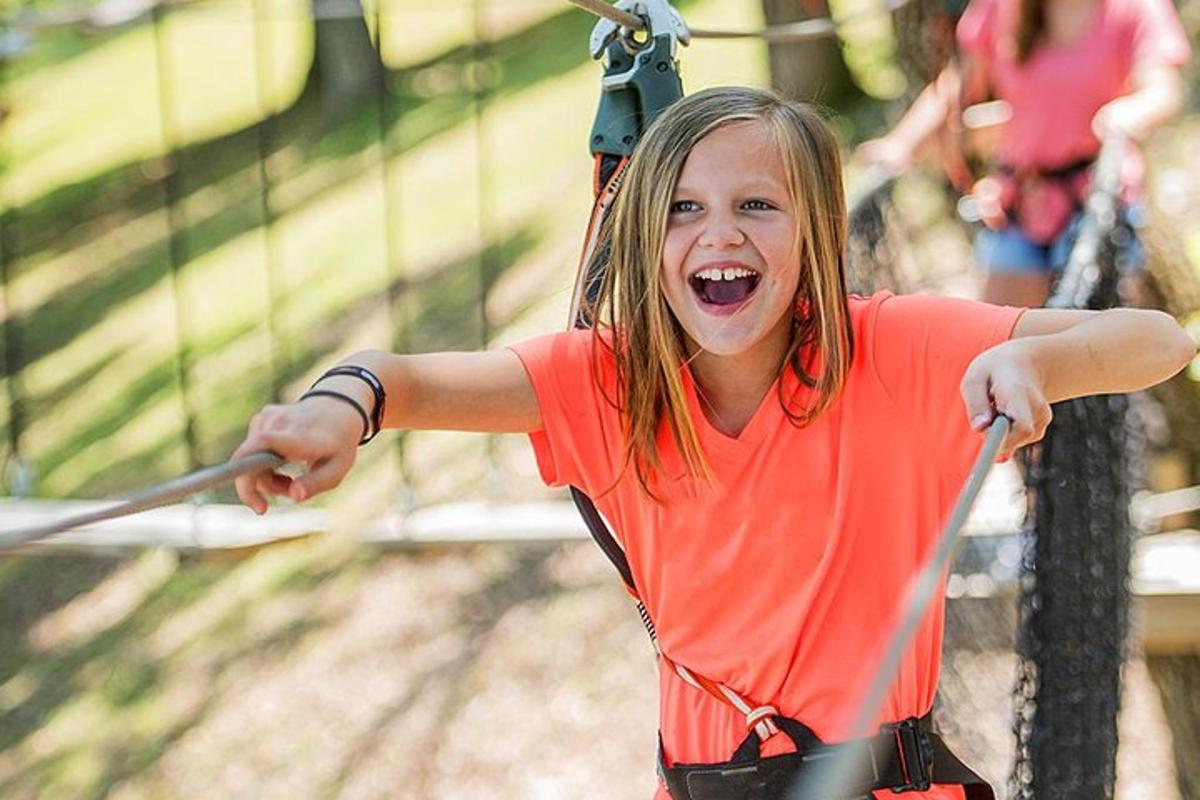 a young girl on a zip line