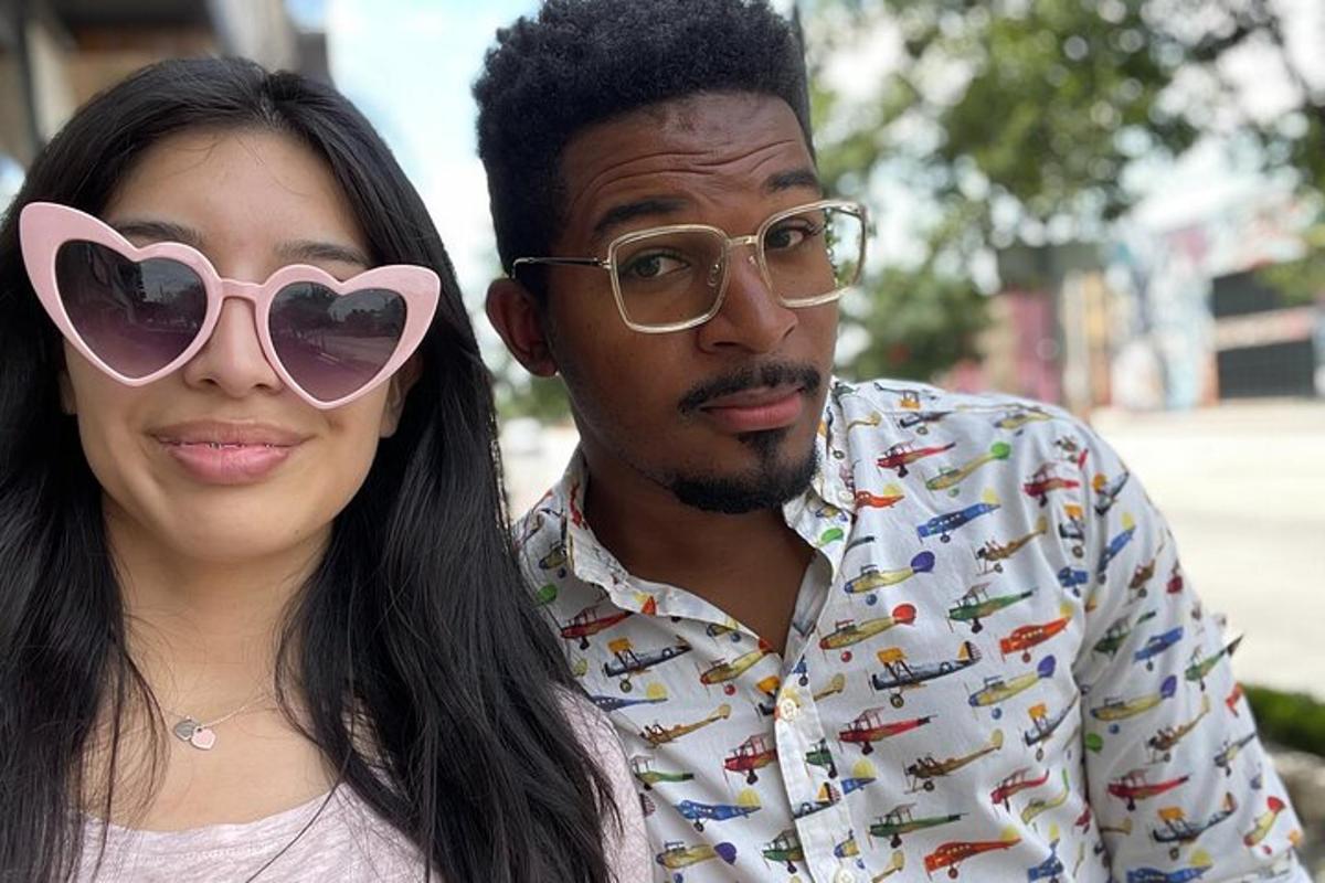 a man and a woman wearing heart shaped sunglasses