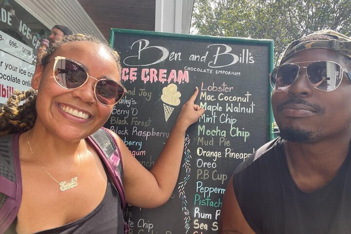 a man and a woman standing in front of a sign