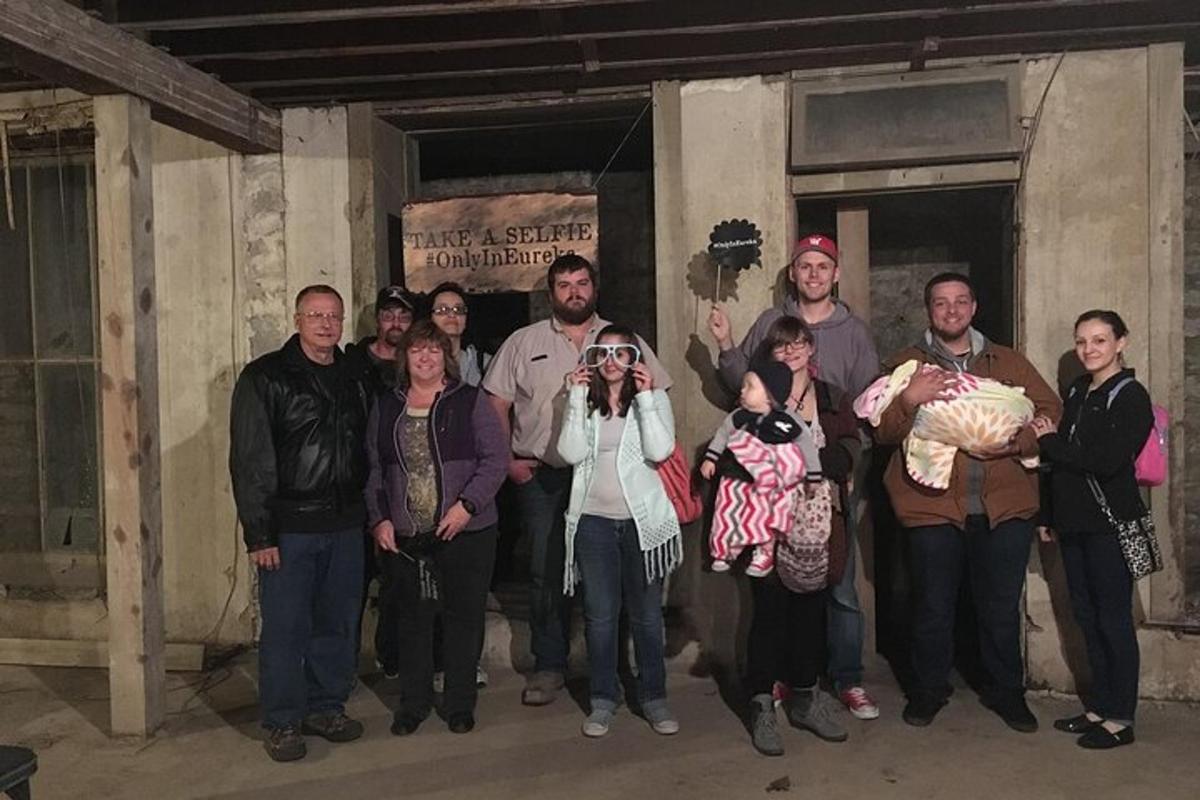a group of people are posing for a picture