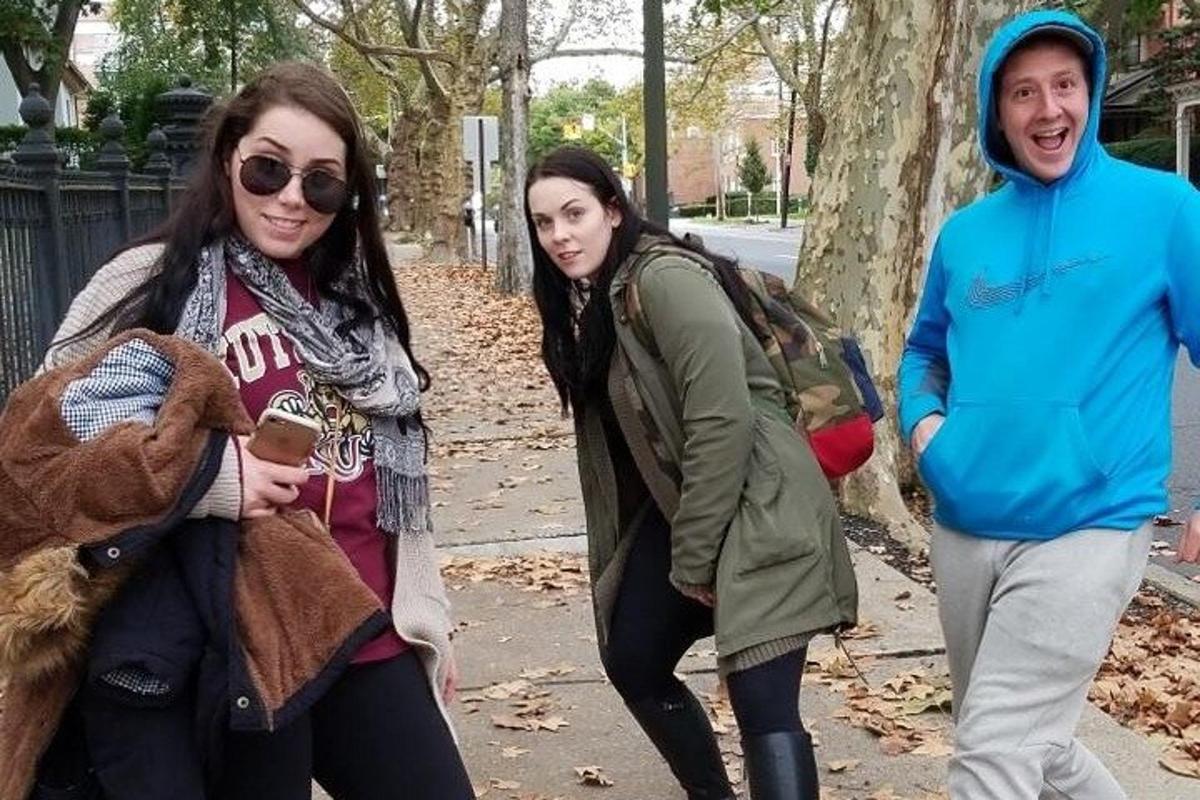 a group of people walking down the street