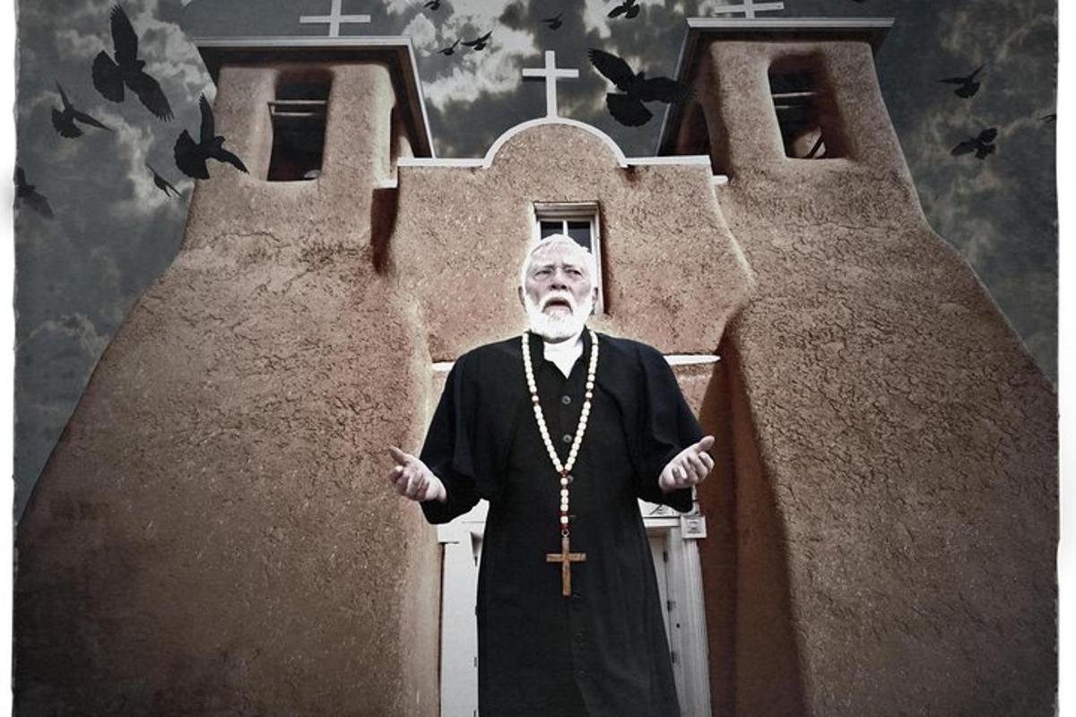 a priest is standing in front of a church