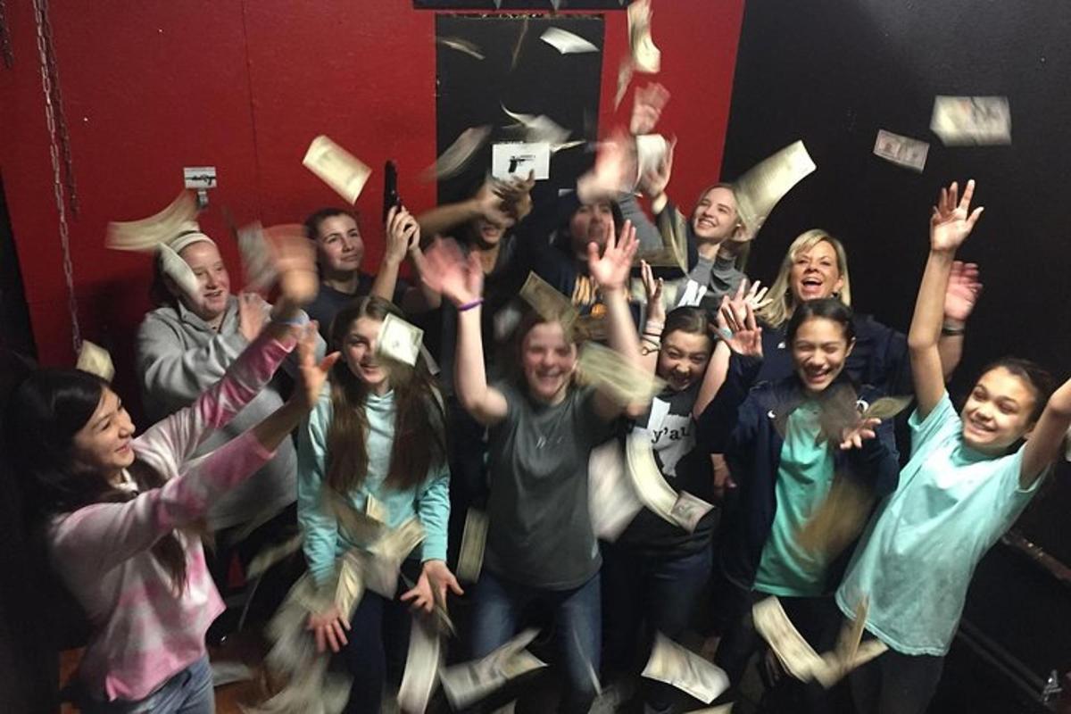a group of people with their hands in the air