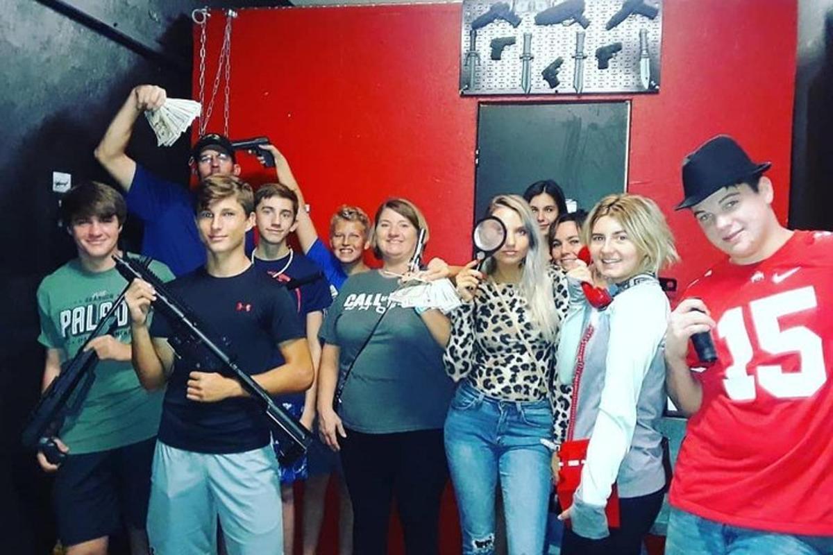 a group of people standing in a room with microphones