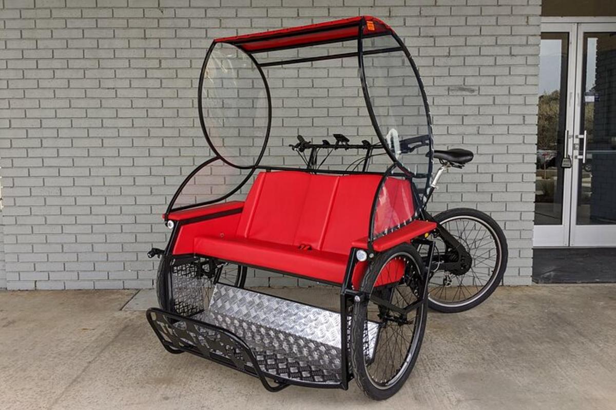 a red bike parked in front of a building
