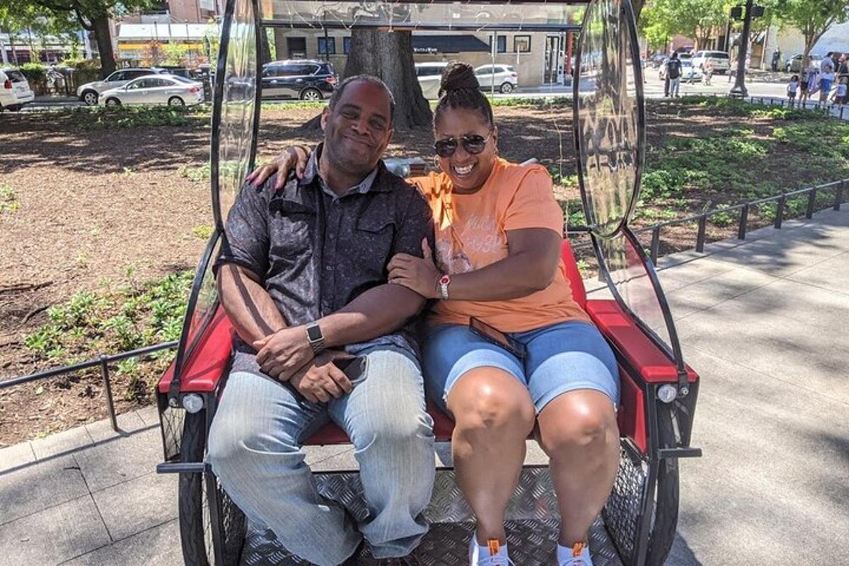 a man and a woman sitting on a carousel