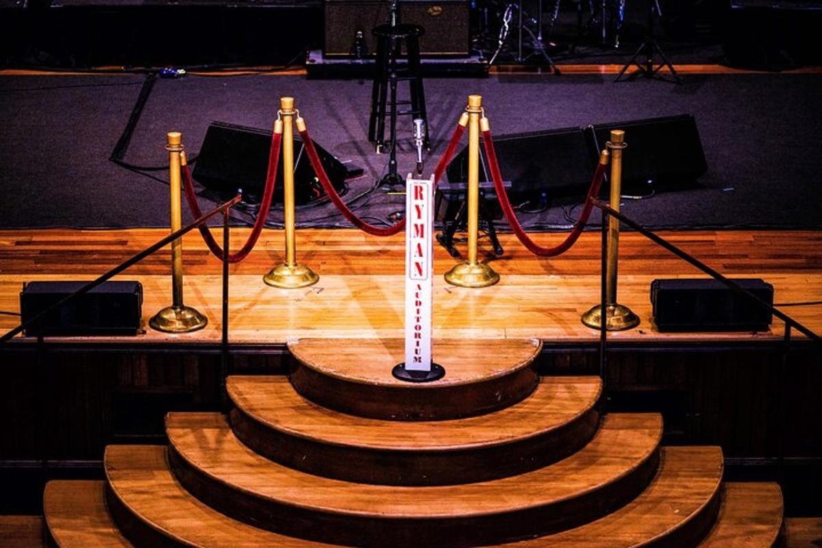 a stage with a wooden table with a sign on it