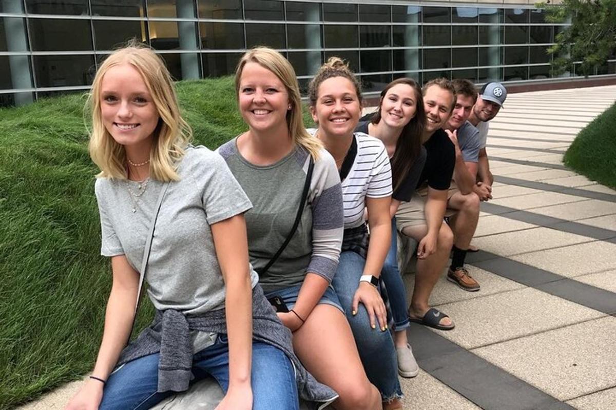 a group of people sitting on a bench