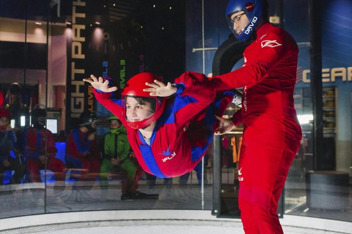 a man and a boy are dancing on the ice
