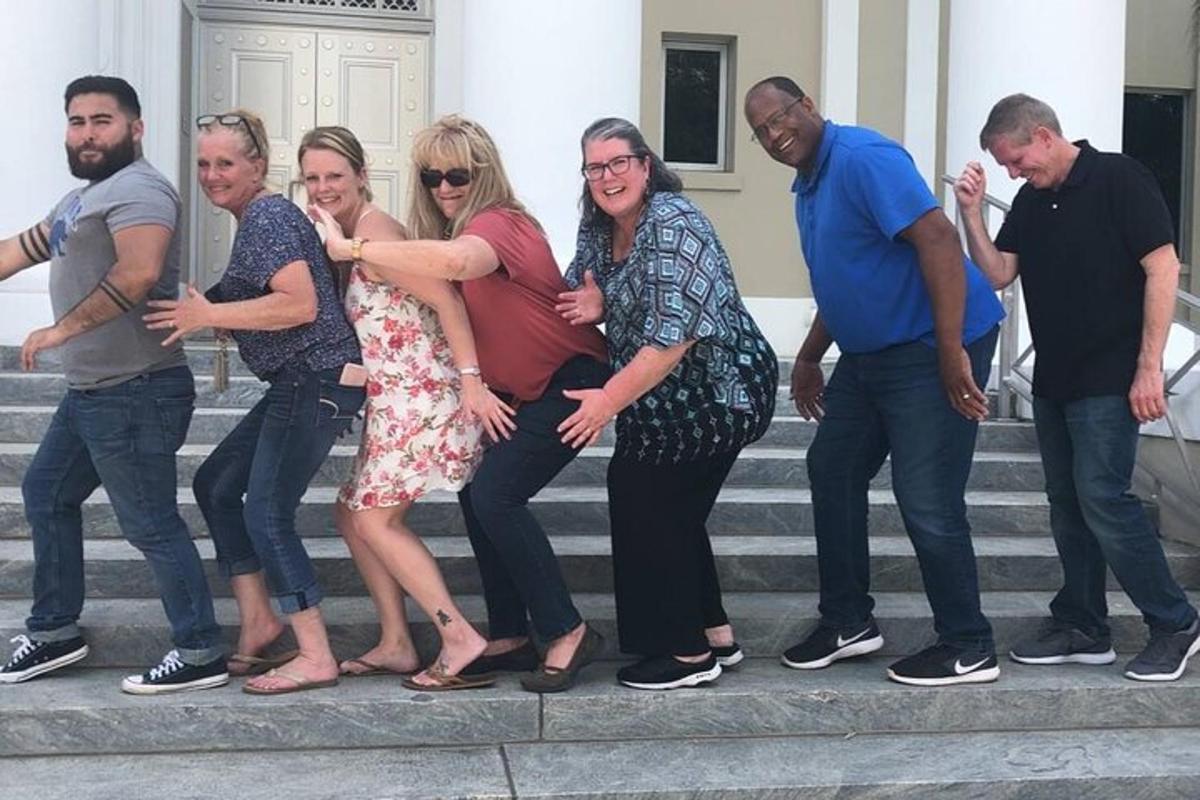 a group of people standing on some steps
