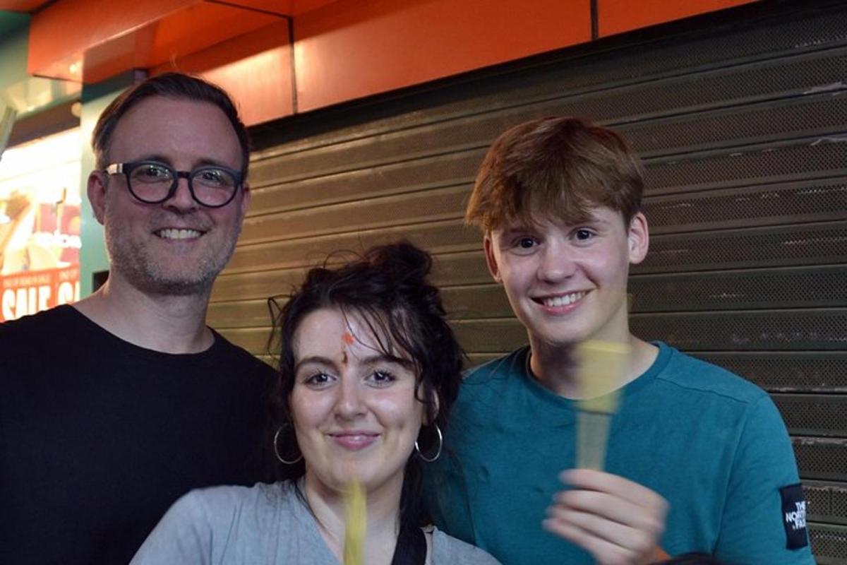 a group of three people posing for a picture