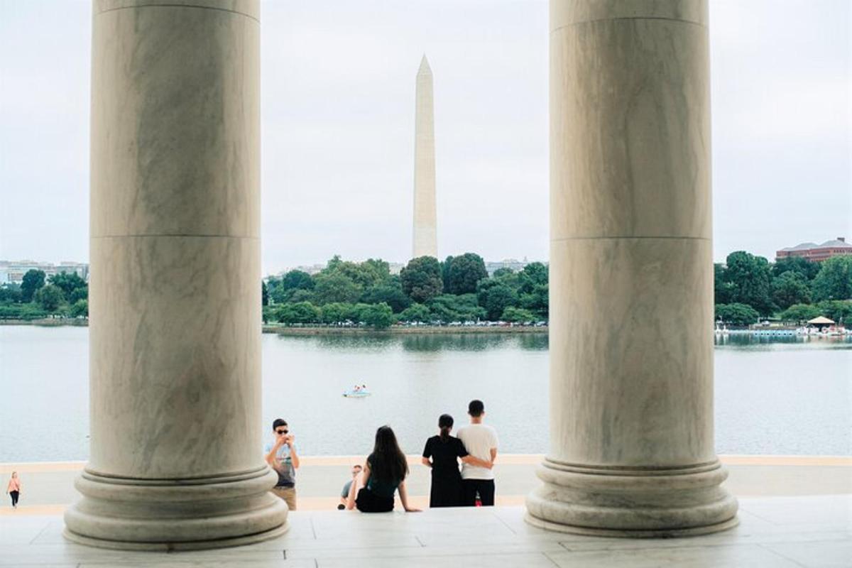 a group of people standing in front of the washington monument