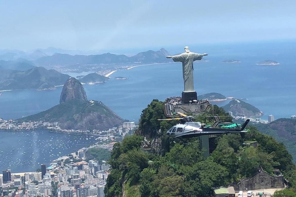 an airplane flying over the christ the redeemer statue