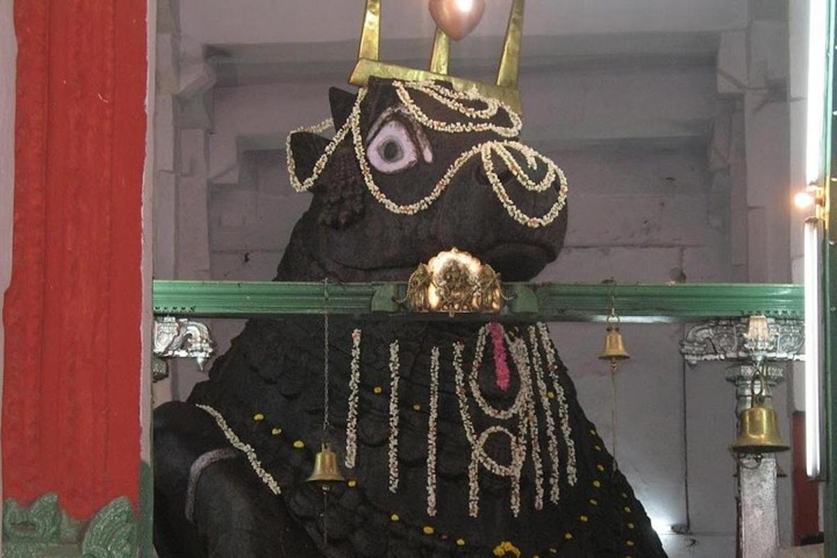 a statue of a gorilla with a crown on its head
