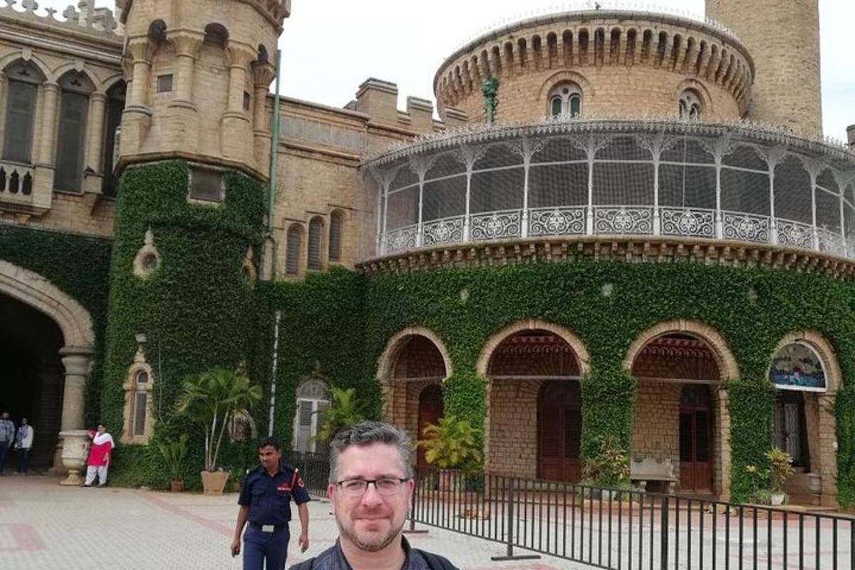 a man is standing in front of a building