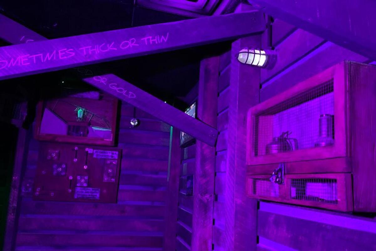a room with purple lights and some stairs