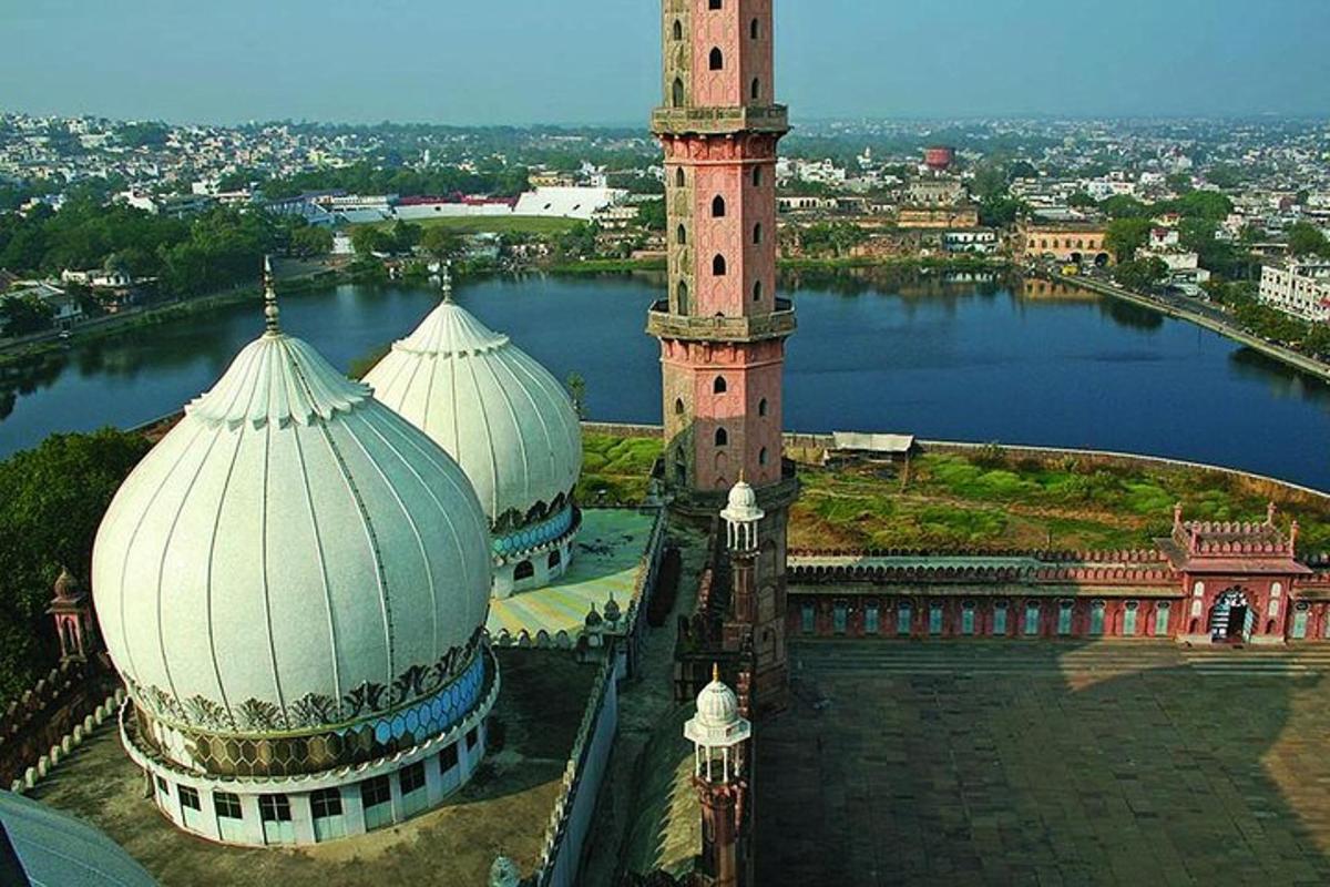 an aerial view of a mosque with two towers