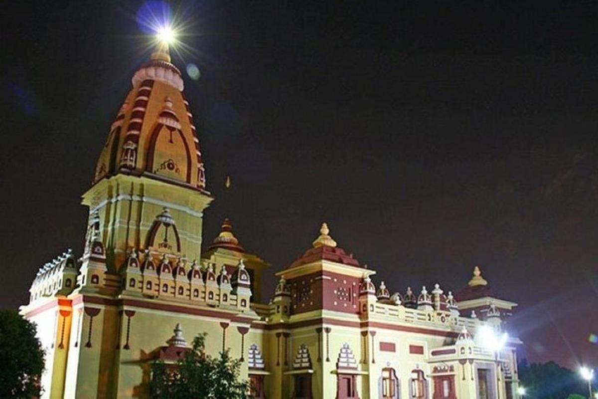 a large building with a clock tower at night