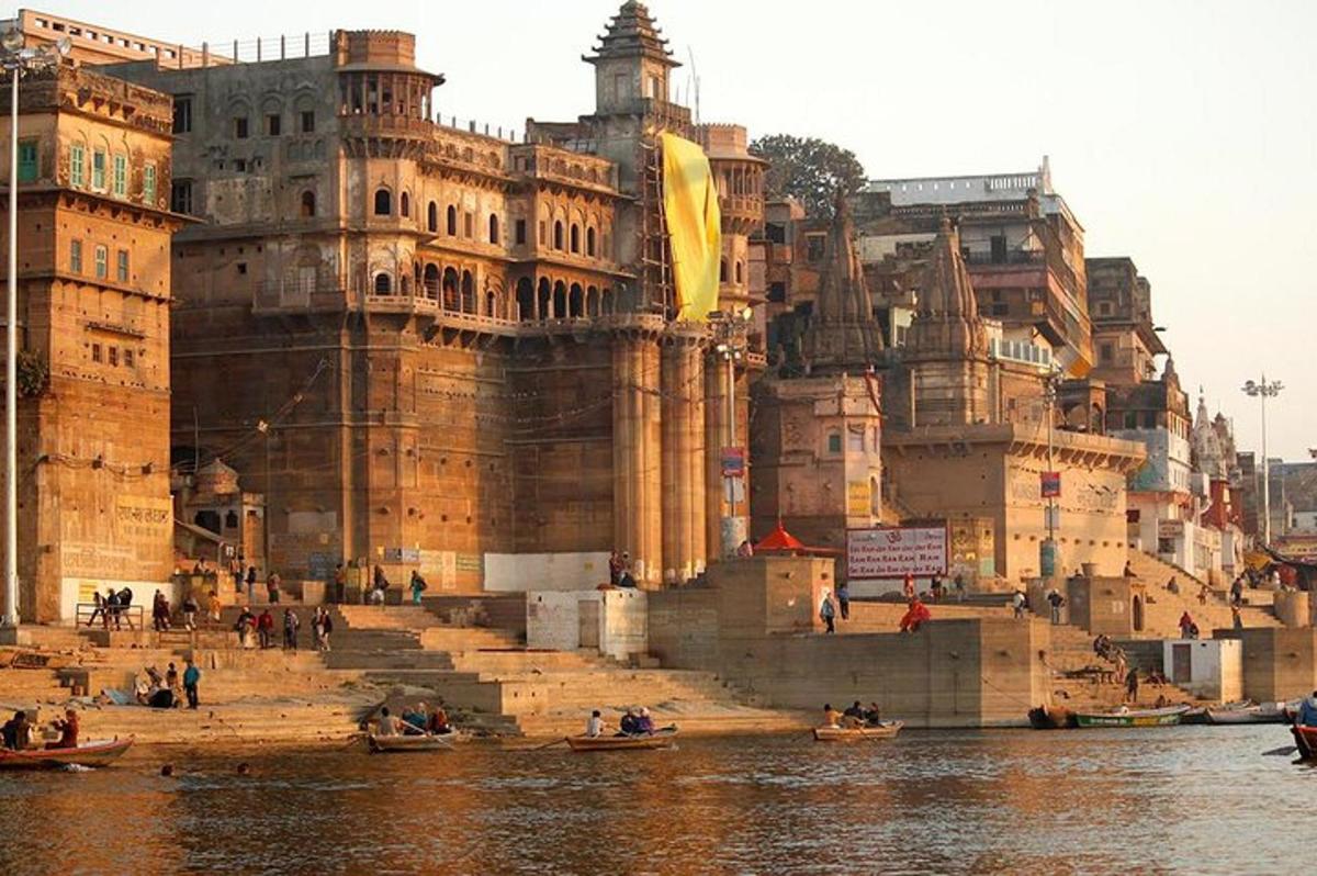 a group of people in boats in front of a large building
