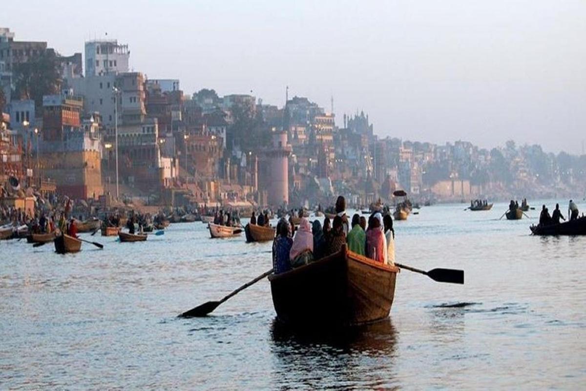 a group of people in a boat on the water
