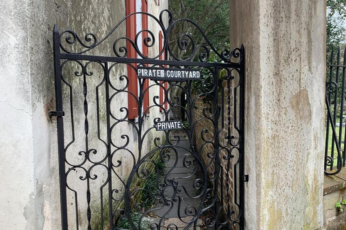 a wrought iron gate with a gateowment sign on it