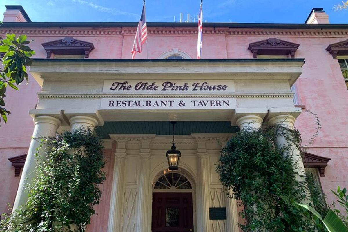 a pink building with a sign for the office park house