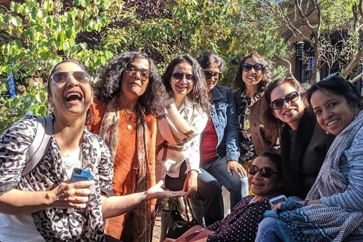 a group of women are posing for a picture