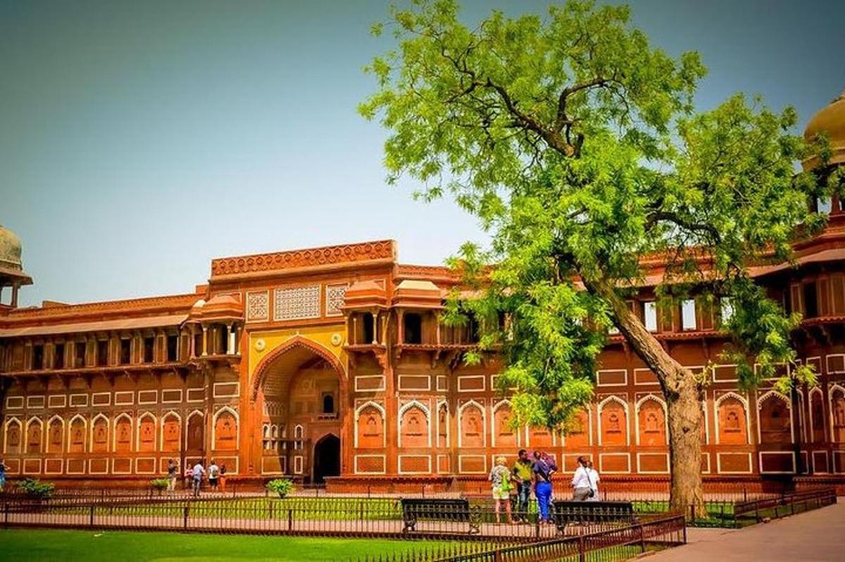 a large building with people standing in front of it