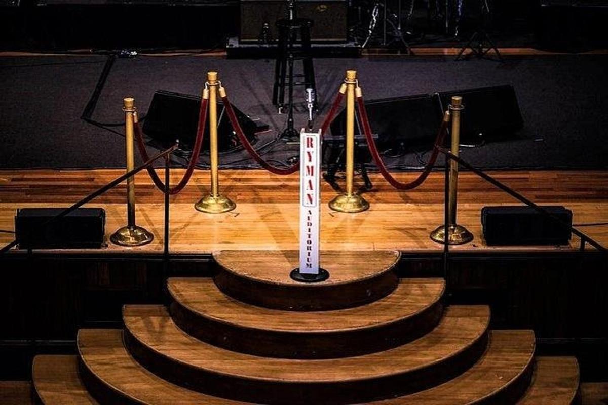 a stage with a table with a sign on it