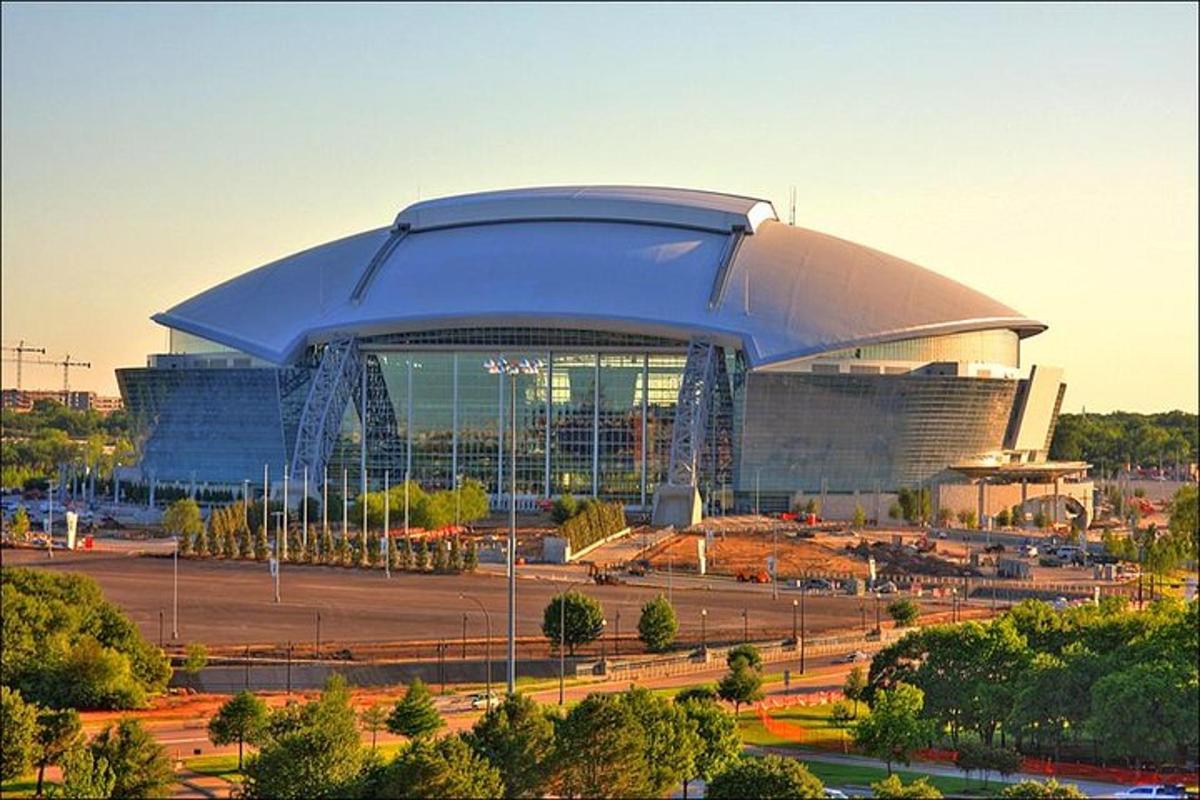 a large building in front of a stadium
