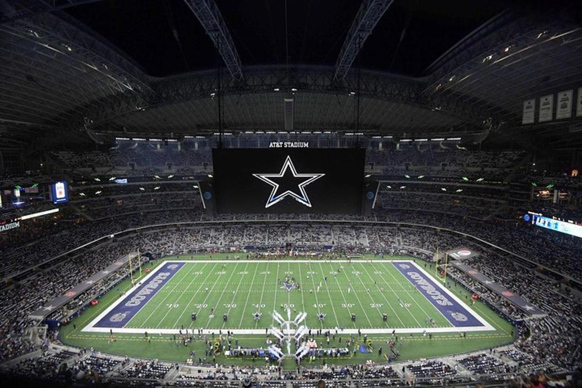 an arena with a football field with a star on it