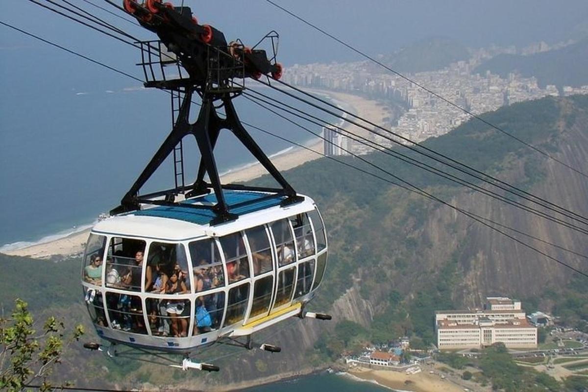 a group of people riding in a cable car