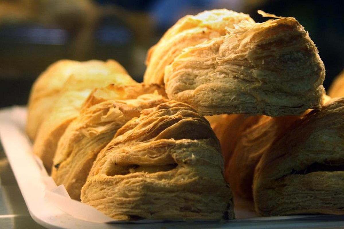 a pile of croissants sitting on a plate