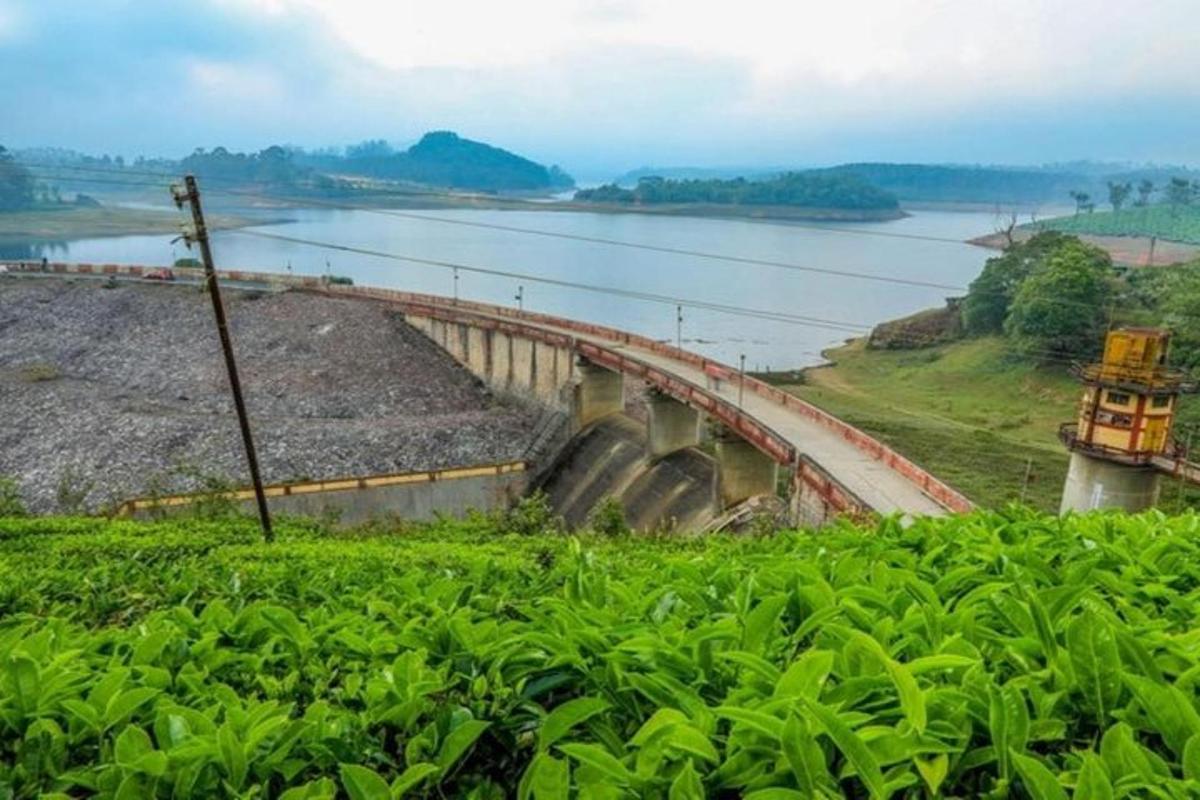 a dam on a river next to a body of water