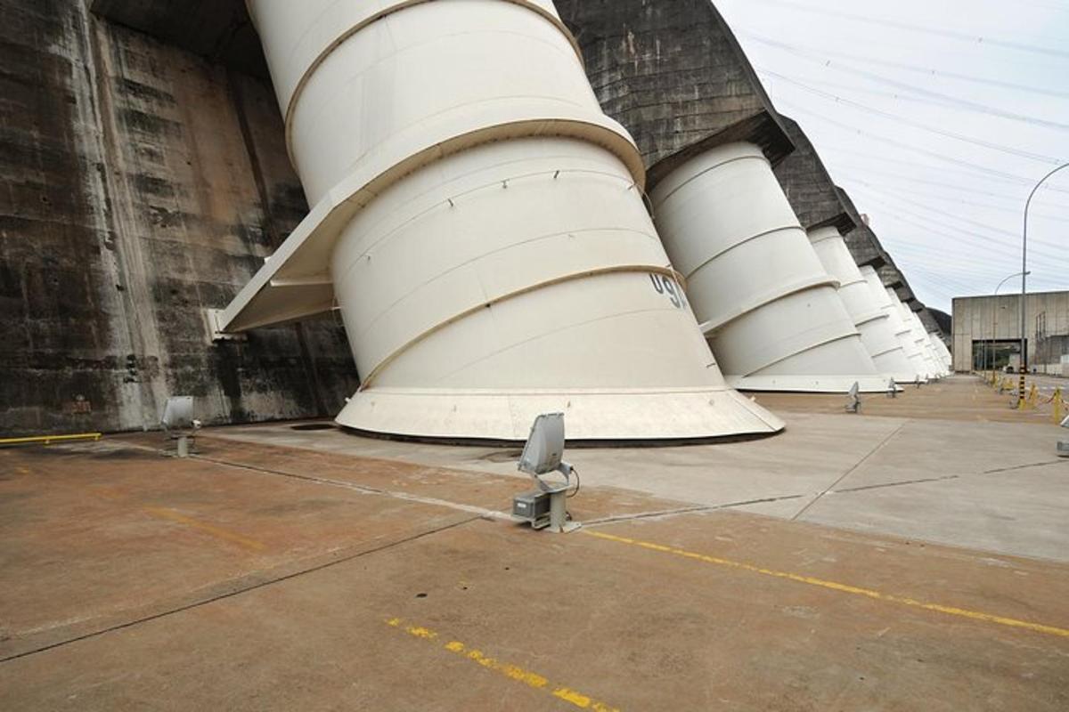 a group of white tanks sitting next to a building