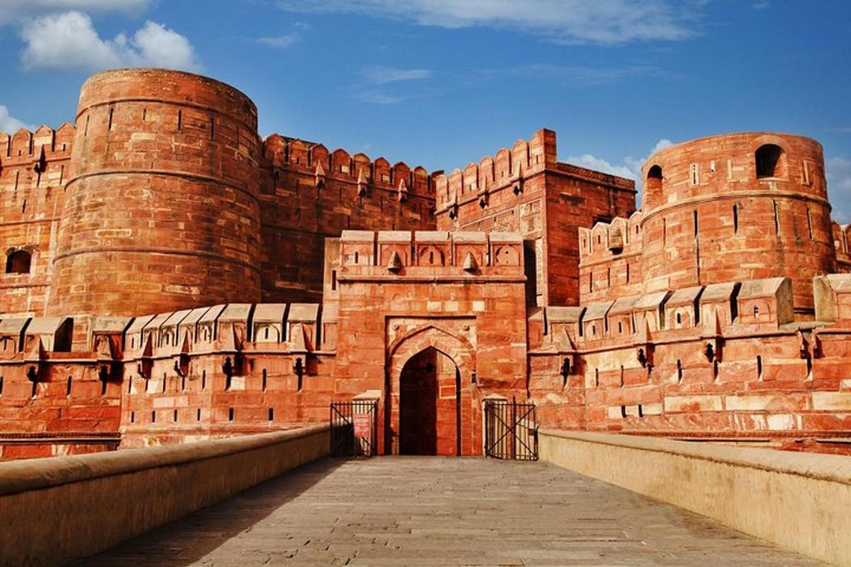 a large red brick building with an arch way