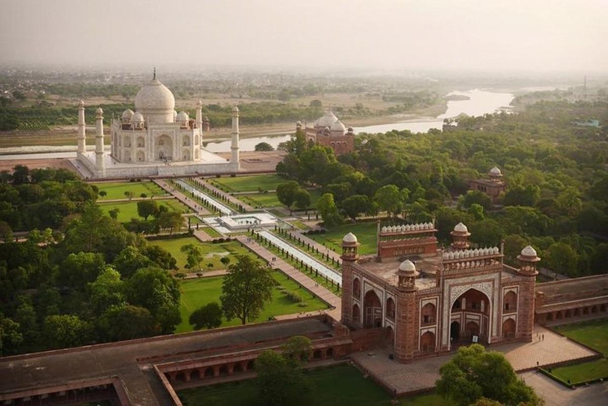 an aerial view of a building and a park