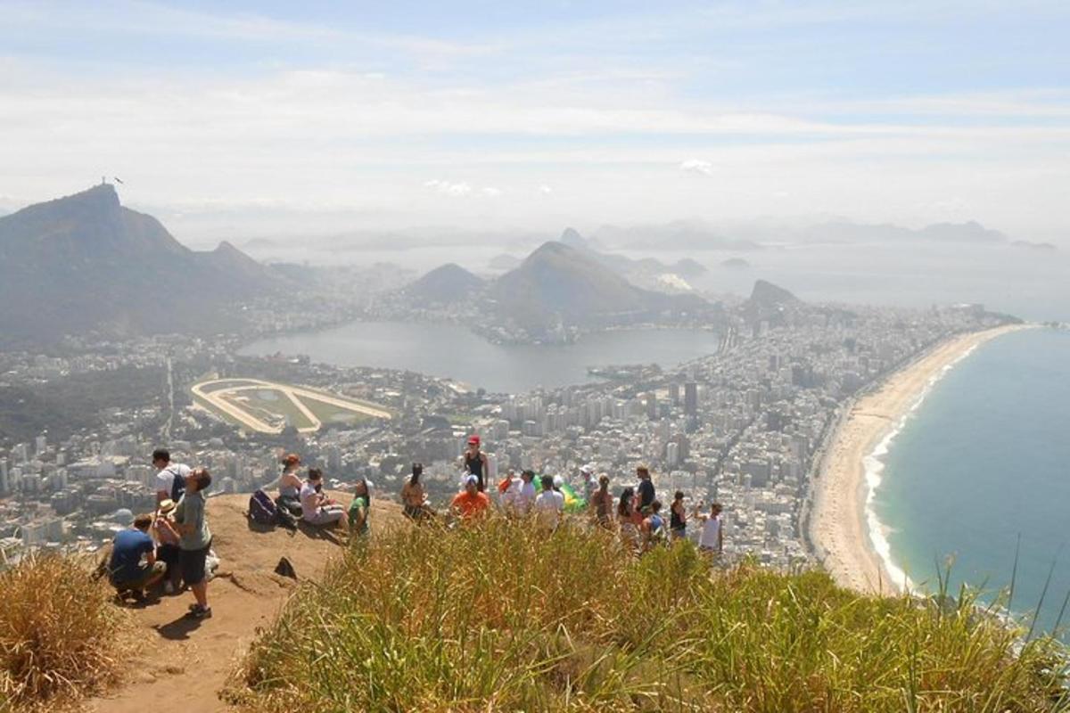 a group of people standing on top of a mountain
