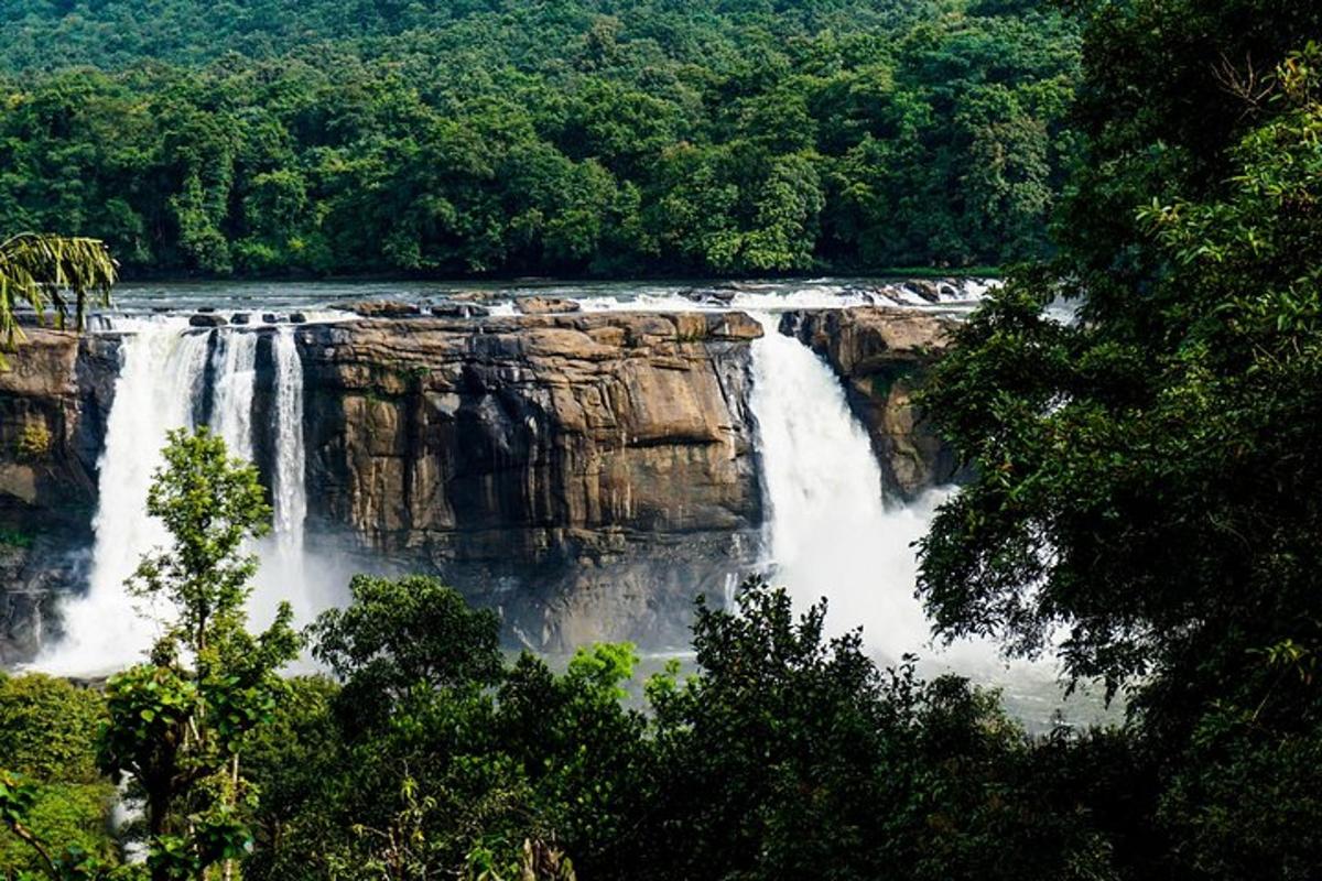 a large waterfall in the middle of a river