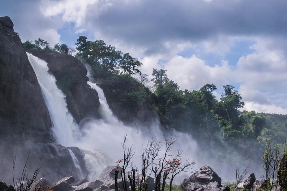 a waterfall in the middle of a mountain